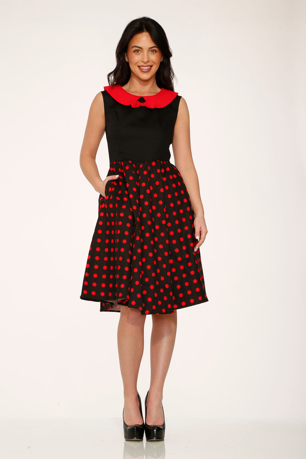 Black and red polka dot swing dress with red peter pan collar