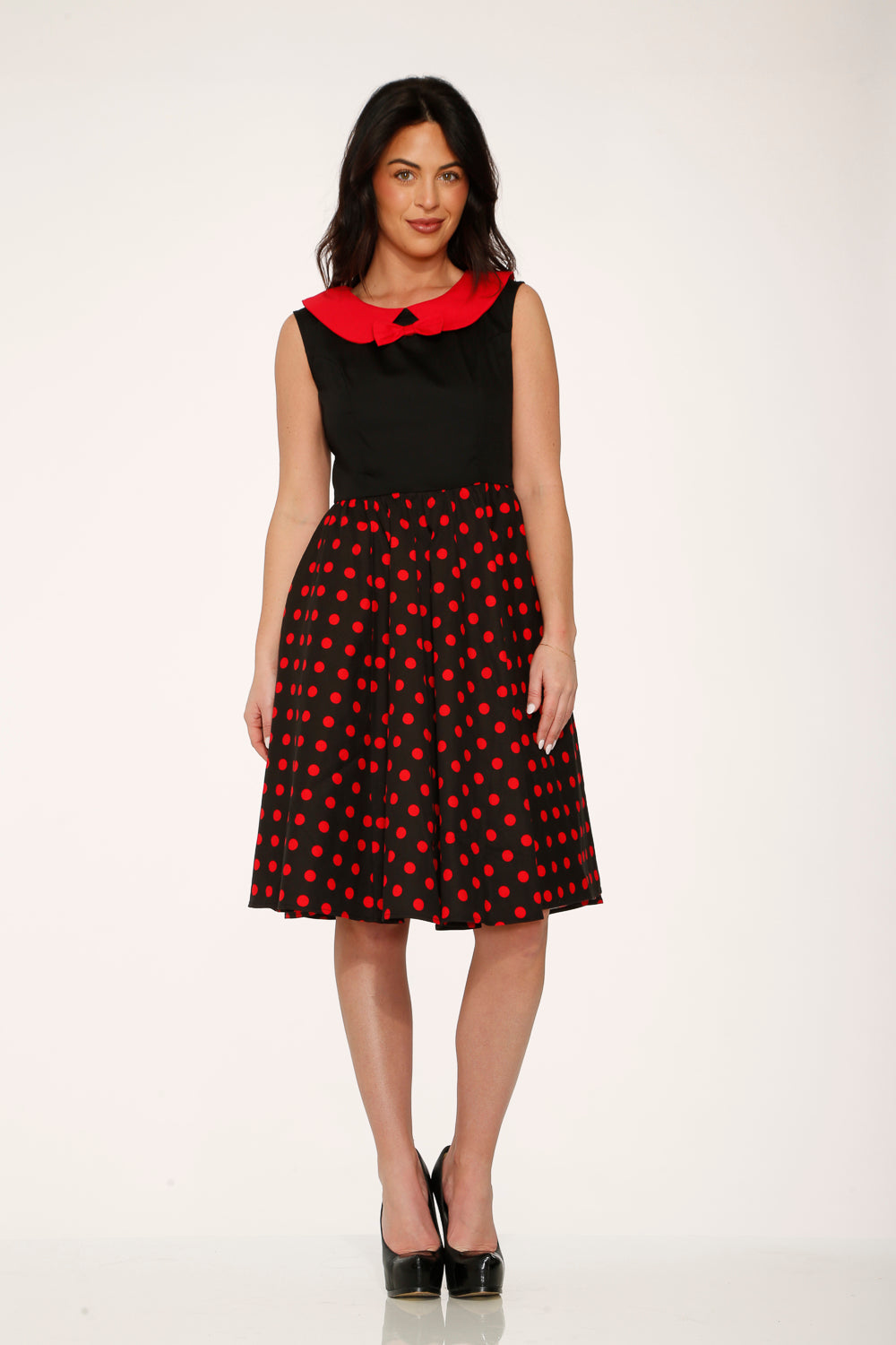 Black A-line swing dress with red polka dot skirt and contrasting red collar