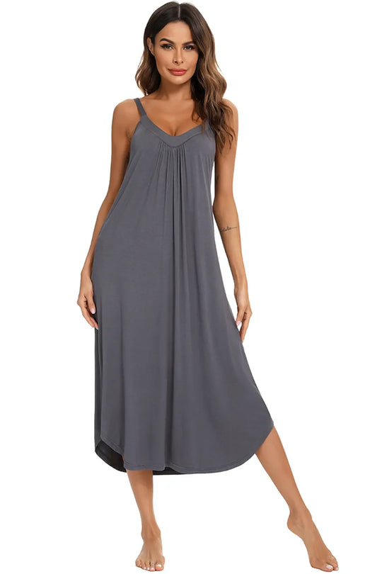 Front view of dark gray V-neck midi lounge dress with thin straps and gathered bust