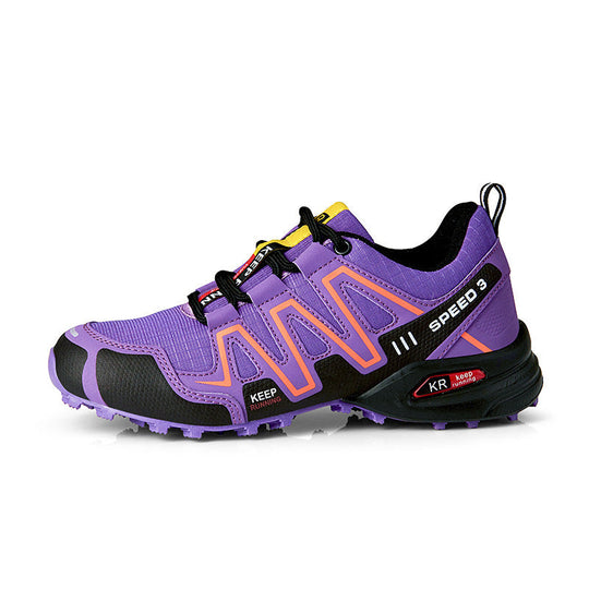 Off-road running shoe: purple upper with black overlays, grippy knobby outsole.