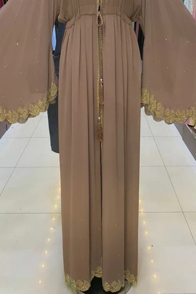 Front view of Nemesia abaya with gold sequin placket and pleated skirt panels