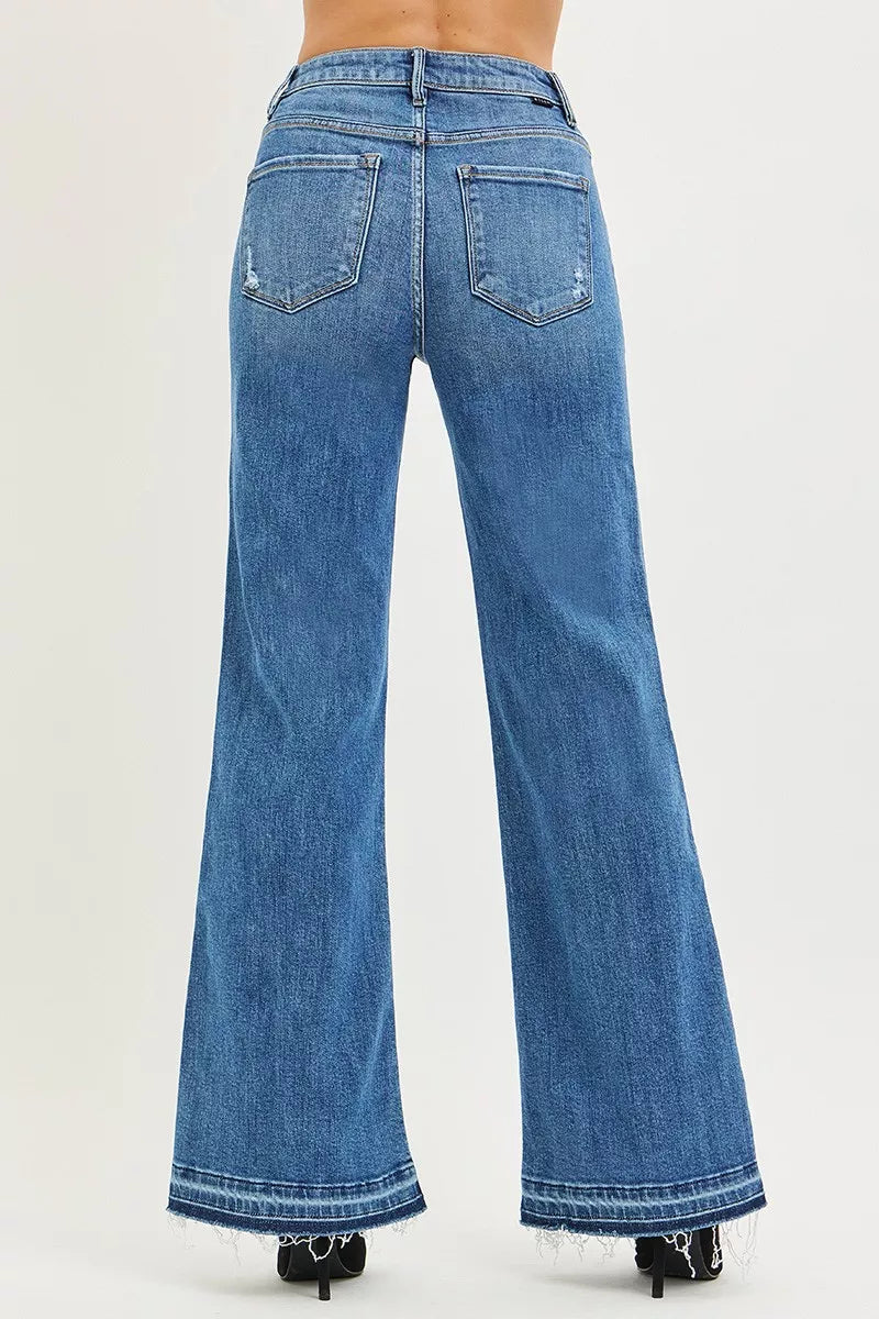 Medium wash high-rise wide-leg jeans with back pockets and frayed hem