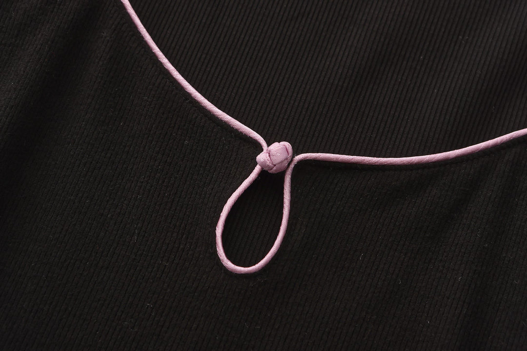 Gao cutout maxi dress strap detail, pink cord tie at neckline on black fabric
