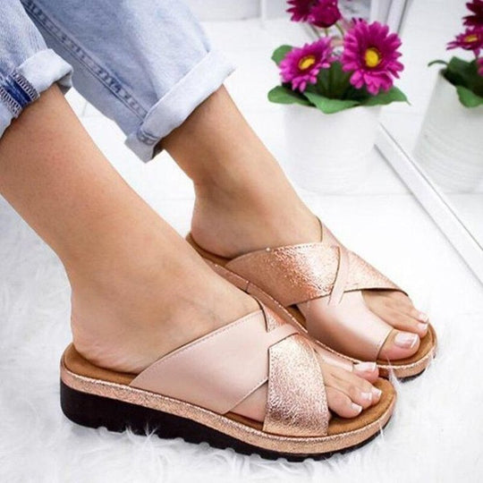 Champagne women’s slide sandals with open toe, toe thong strap, and thick sole