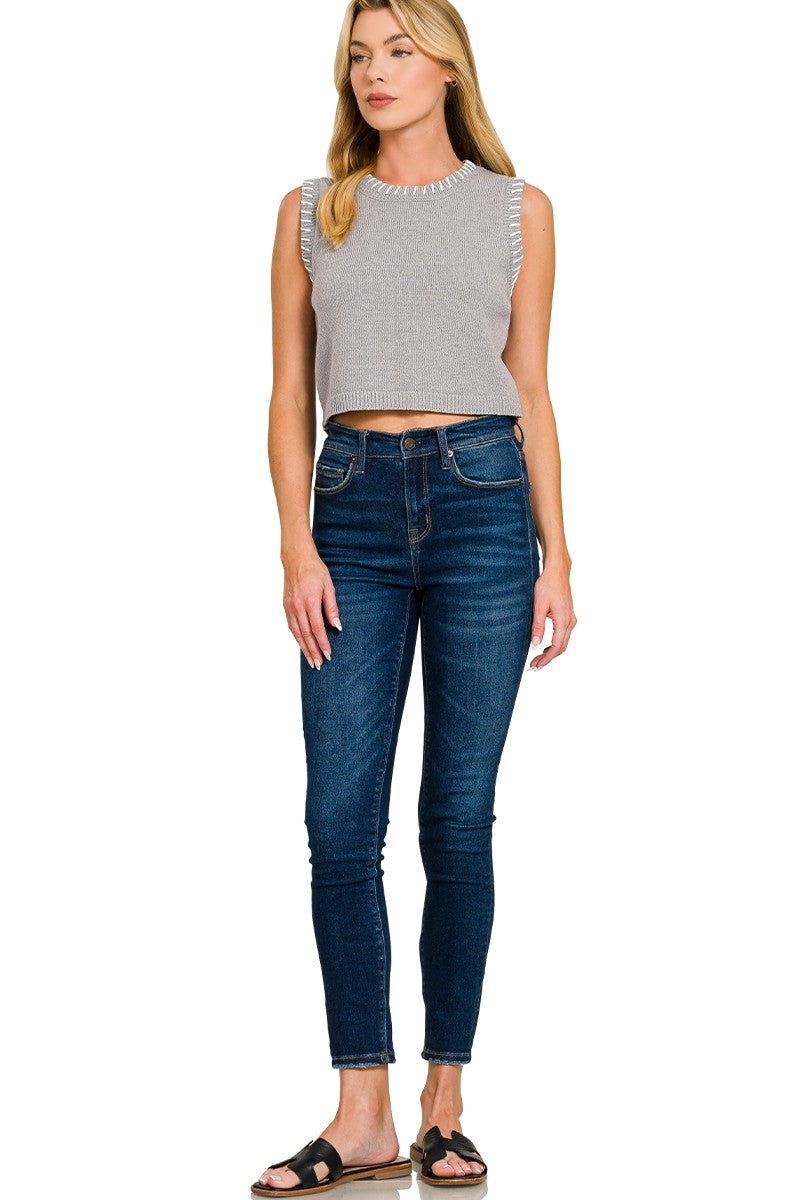 Light grey cropped sweater vest, sleeveless knit with stitched armhole edge and ribbed waist