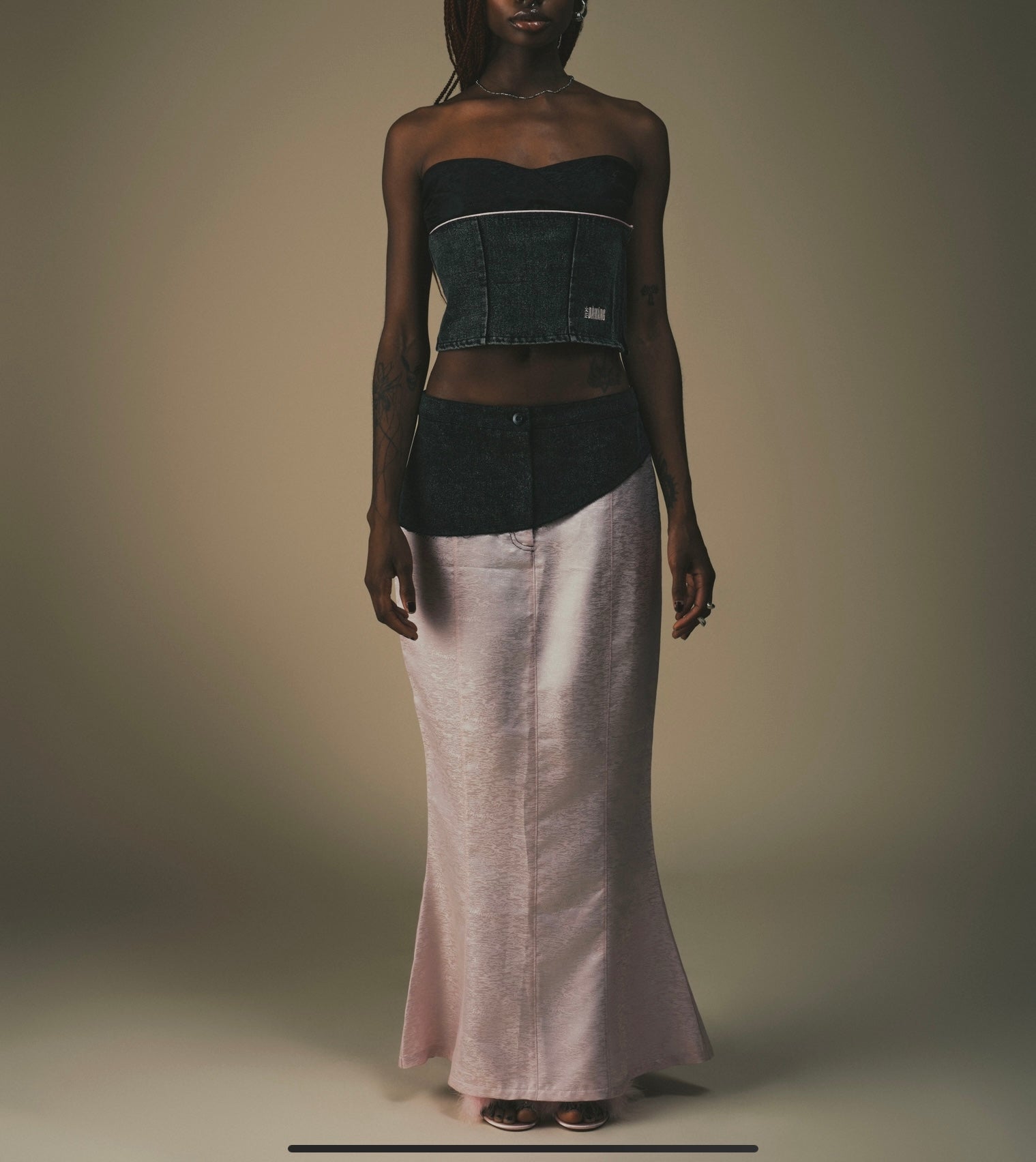 Fei Patch Maxi Skirt: light pink maxi skirt with dark patch at the waist.