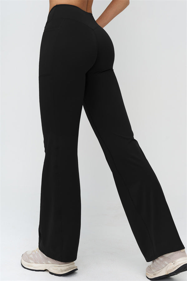 Schwarze Flared Leggings: ausgestelltes Bein, hoher Bund, seitliche Naht im Beinverlauf