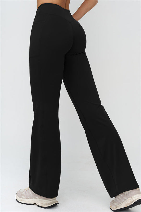 Schwarze Flared Leggings: ausgestelltes Bein, hoher Bund, seitliche Naht im Beinverlauf
