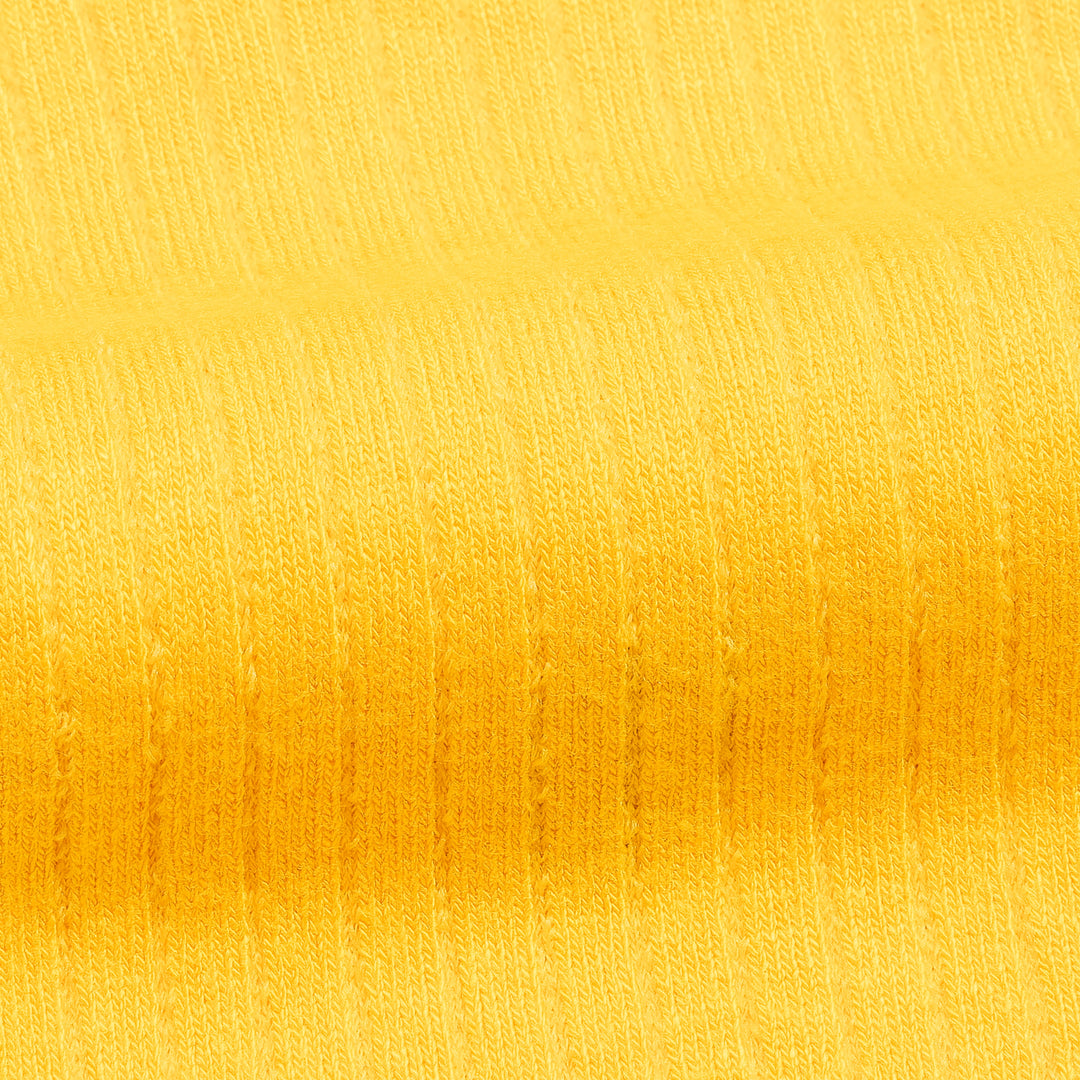 Close-up of yellow bamboo trouser sock fabric with fine striped rib knit