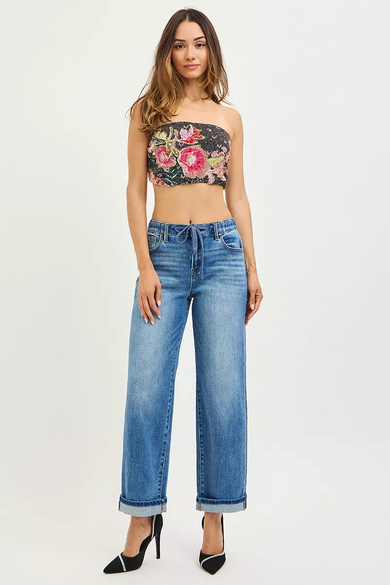 Medium wash slouchy boyfriend ankle jeans with elastic waist tie and cuffed hem