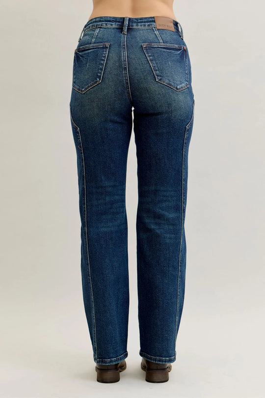 Dark straight-leg jeans back view with seam detail and two rear patch pockets