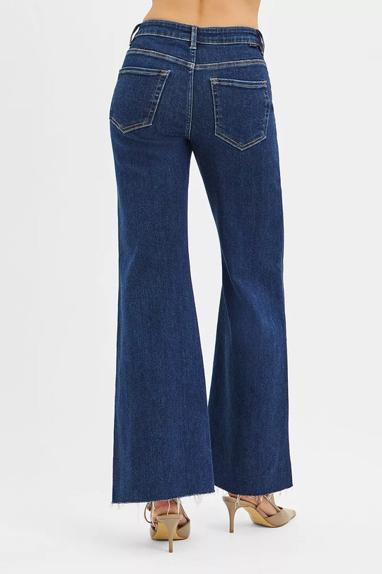 Dark high-rise wide-flare jeans back view with two welt pockets and button closure