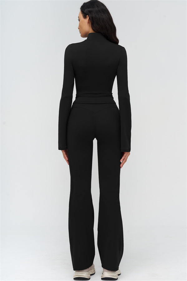 Black flared leggings with cropped zip jacket, athletic 2-piece set (back view)