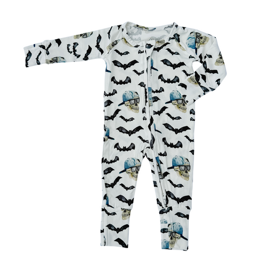 Spooky bamboo zippy pajamas, white with black bats and blue skulls, full-length one-piece