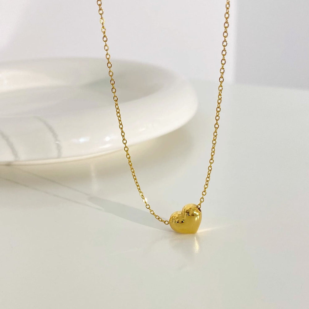 TRIDIUM HEART gold-tone necklace with small heart charm pendant