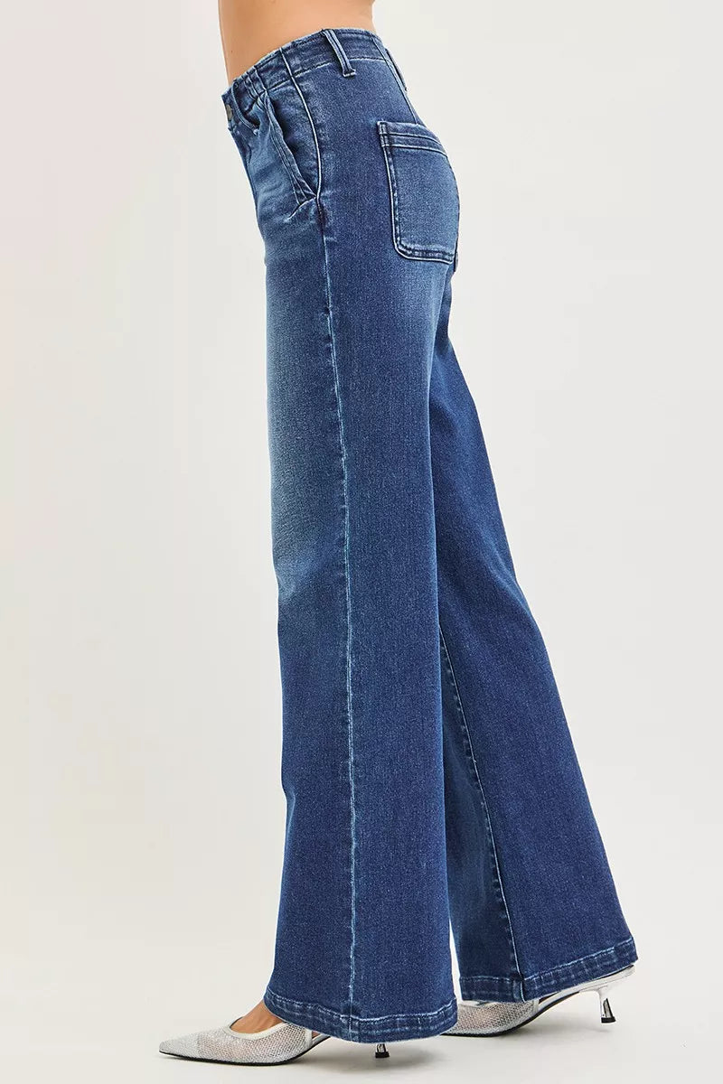 Dark blue wide-leg jeans side view with high-rise waistband and front pocket detail