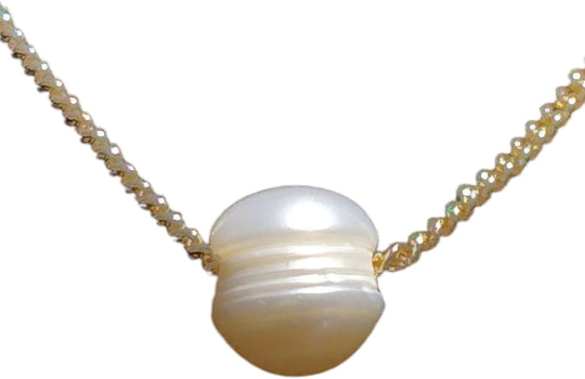 Round white freshwater pearl pendant on gold curb chain necklace