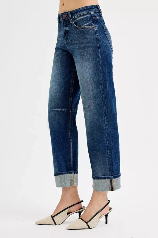 Dark wash slouchy crop jeans in a relaxed fit with cuffed hem, side view