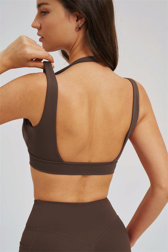 Taupe sports bra with open back and racer-style straps