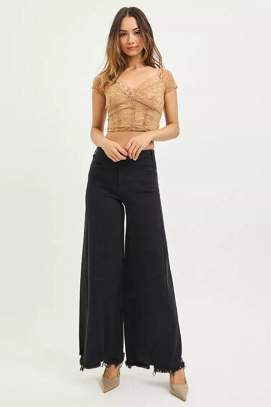 Black high-rise palazzo jeans with frayed hem, wide-leg silhouette