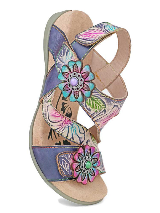 Boho sandals side view: purple patterned straps with large flower charms and cushioned sole