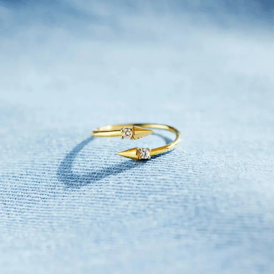 Gold Arrowlight Ring with raised arrow point and round crystal detail
