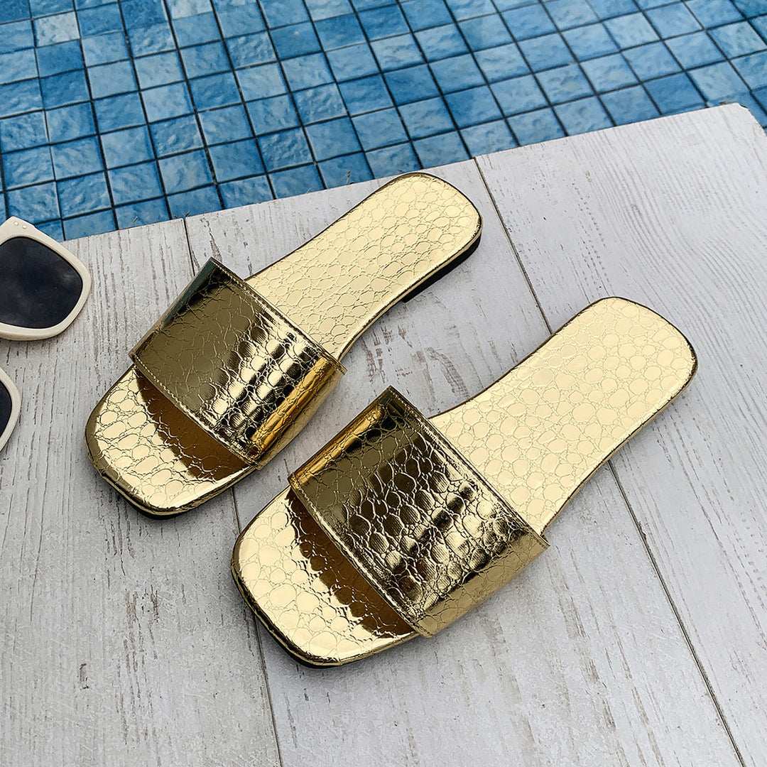 Gold crocodile-textured square-toe slide sandals, flat wide strap pair