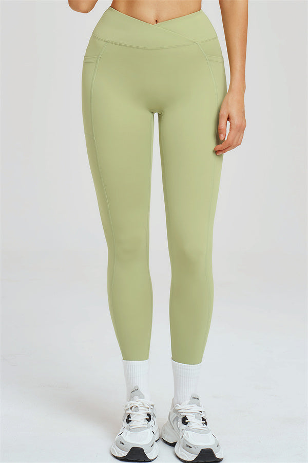 Light olive green leggings with contoured seam details and high waist