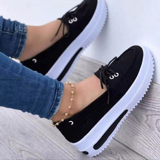 Black platform loafer sneakers with lace-up vamp and thick white sole