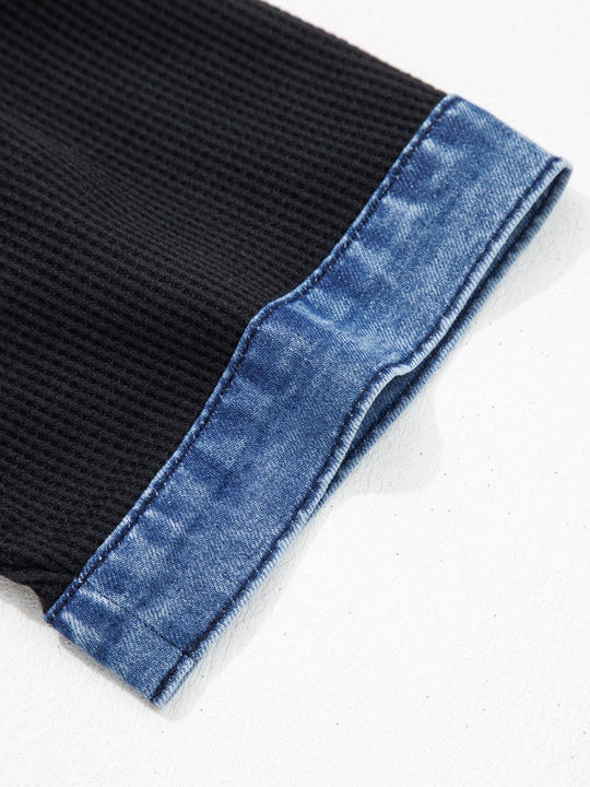 Black sleeve with blue denim cuff and stitched seam