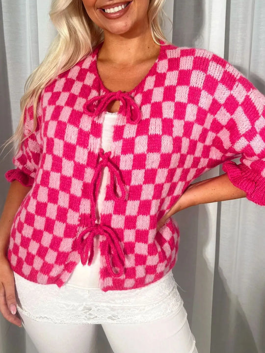 Hot pink checkered tie-front knit cardigan with scalloped trim and drawstring neckline.