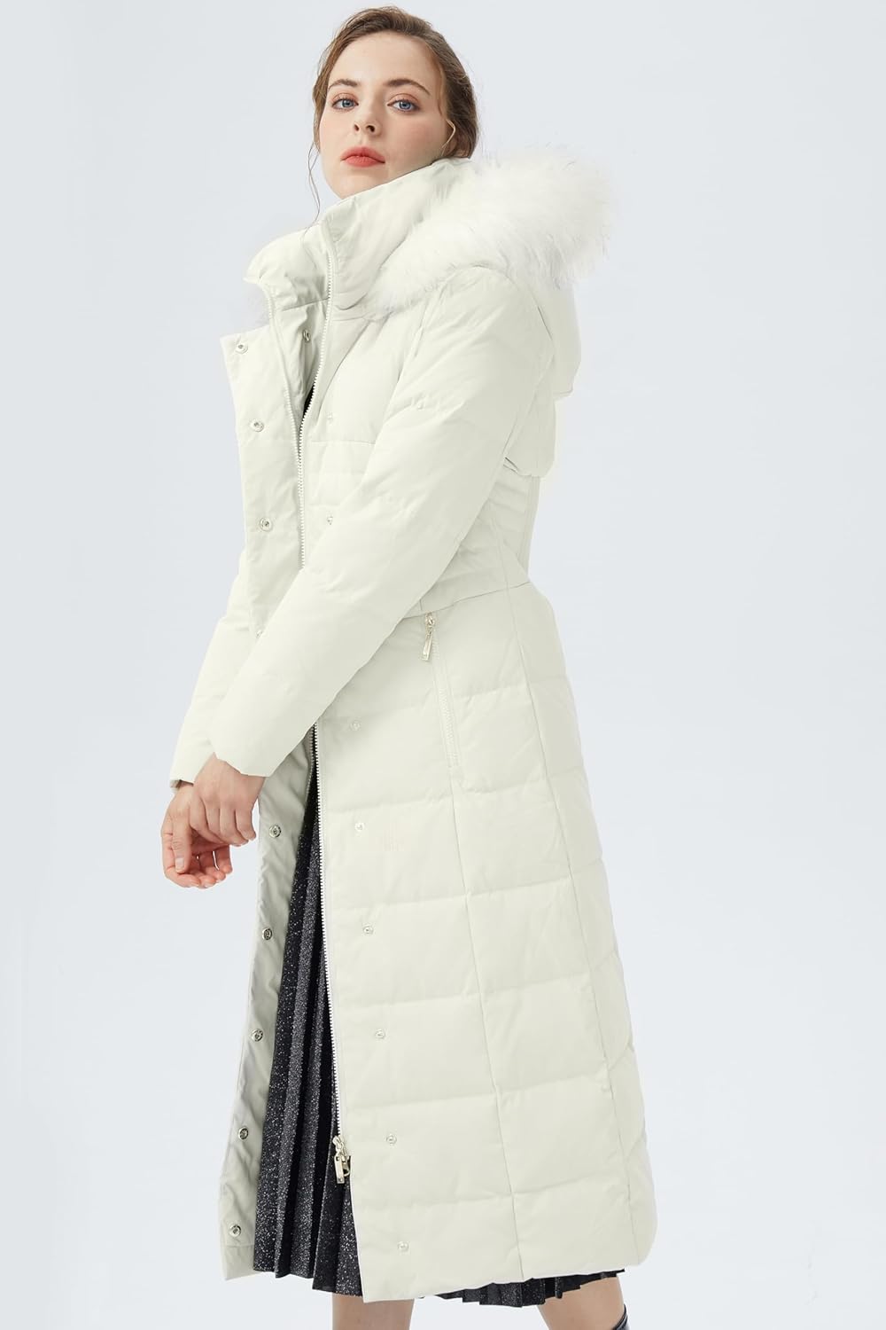 White long puffer parka with fur-trim hood, side profile and zipper