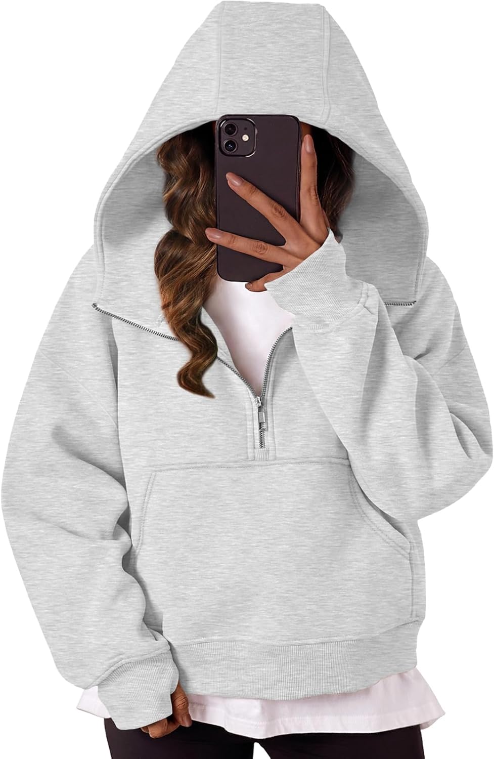 Grey oversized hoodie with quarter-zip, hood, and front pocket pouch