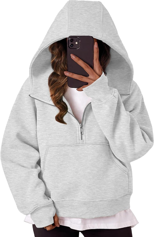 Grey oversized hoodie with quarter-zip, hood, and front pocket pouch