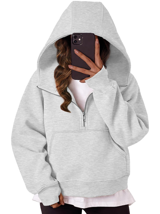 Front view of grey oversized quarter-zip hoodie with hood and kangaroo pocket