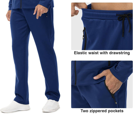 Dark blue track jogger pants with elastic waistband and drawstring, zip pockets