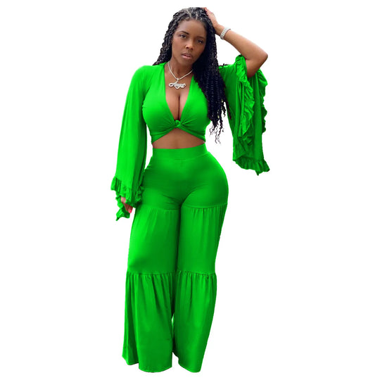 Green wrap-front crop top with long sleeves and matching wide-leg trousers set