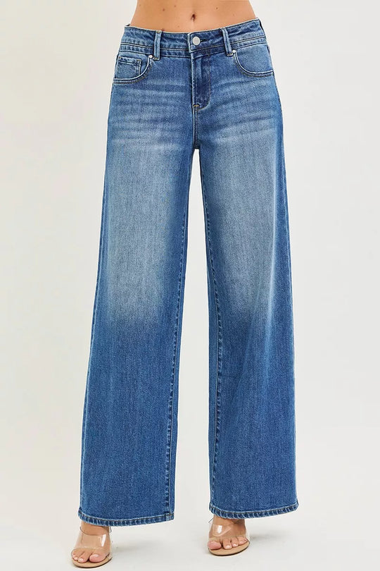 Medium-wash RISEN slouchy baggy jeans with front pockets and button closure
