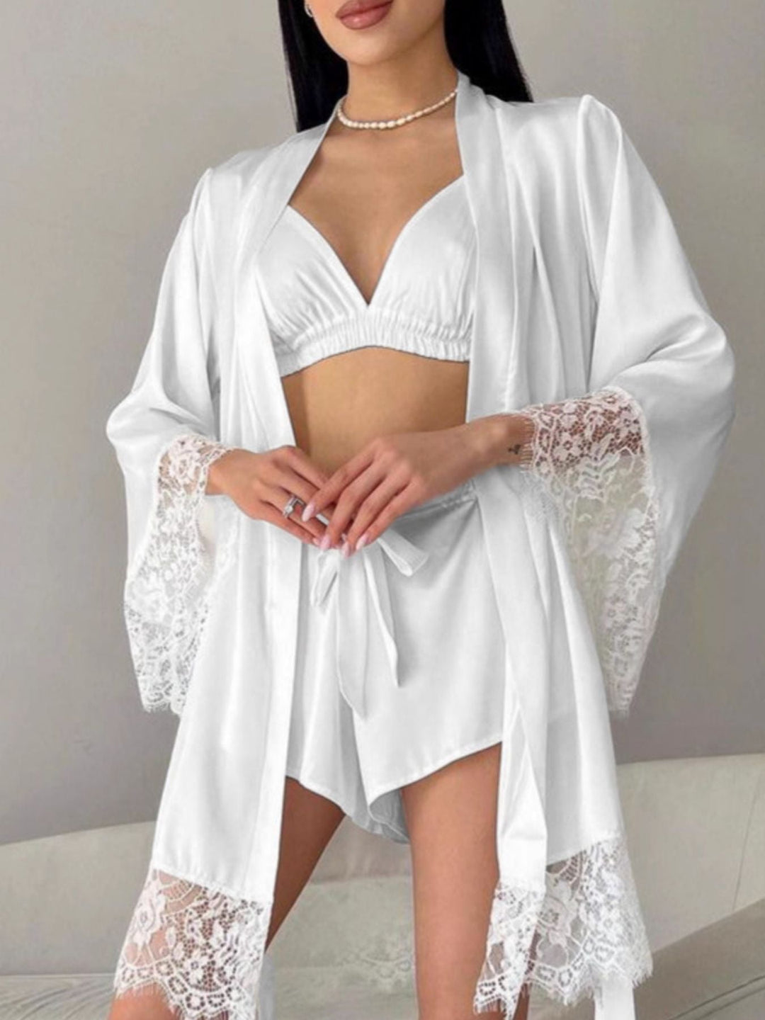 White lounge set with lace-trim cardigan and camisole bra top plus matching shorts