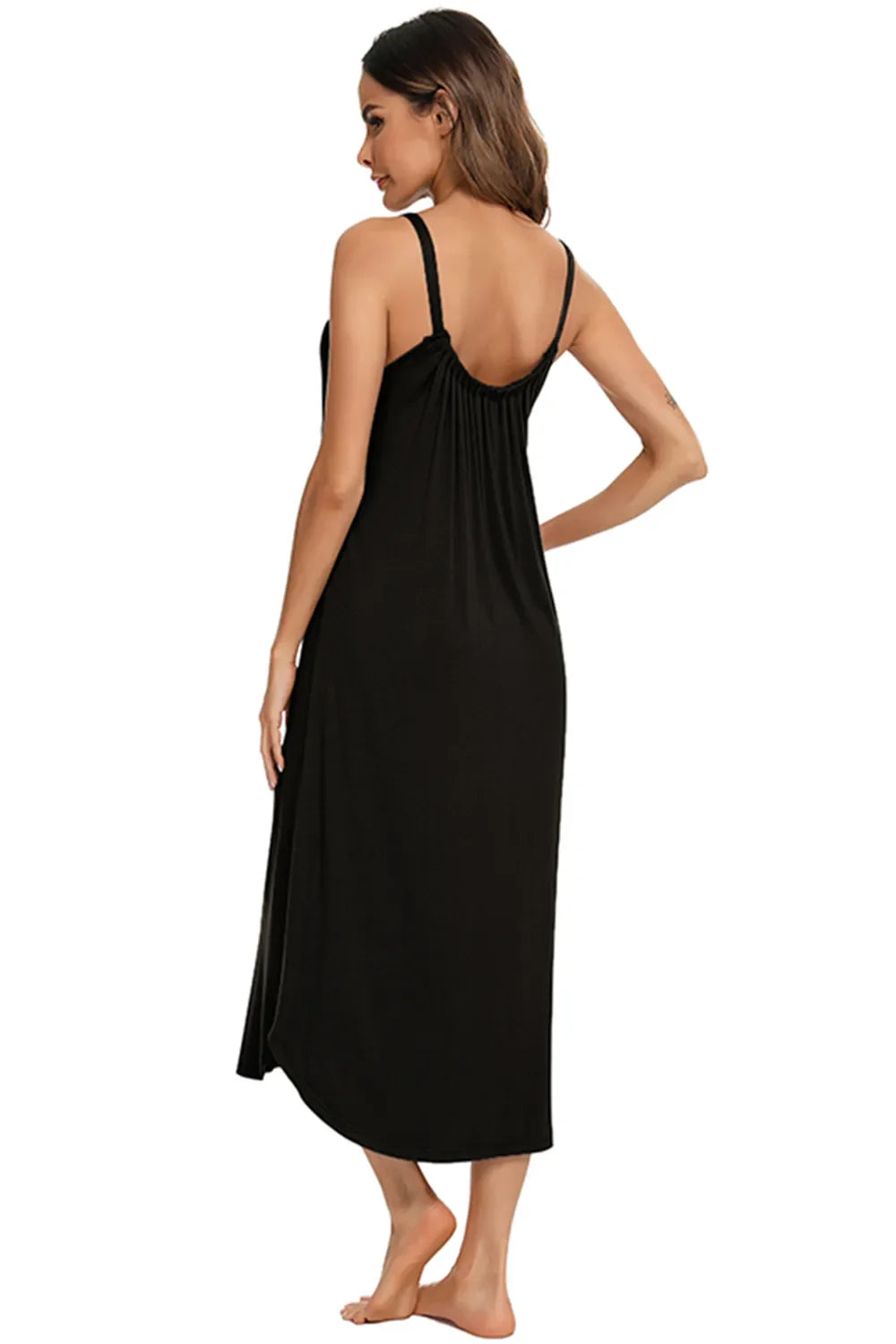 Back view of black V-neck midi lounge dress with thin straps and draped back