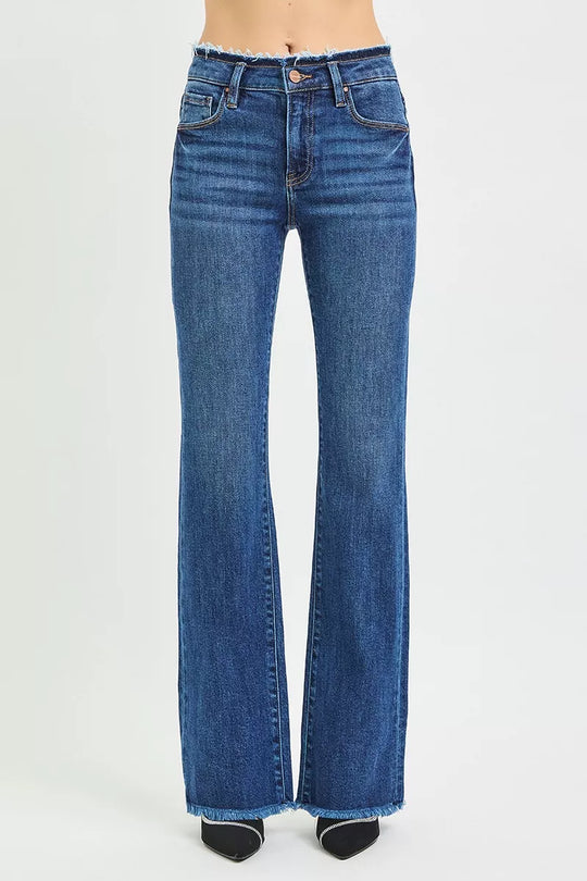 Dark blue mid-rise bootcut jeans, back view with frayed hem