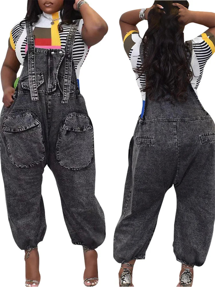 Dark grey wide-leg denim romper with bib front, multiple cargo patch pockets