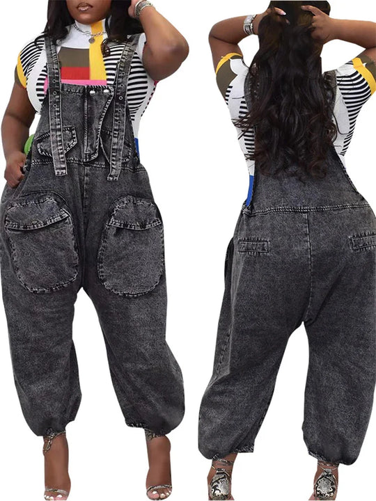 Dark grey wide-leg denim romper with bib front, multiple cargo patch pockets