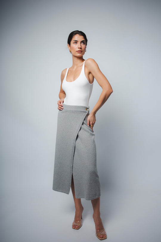 White tank bodysuit, fitted with scoop neckline and high-cut leg