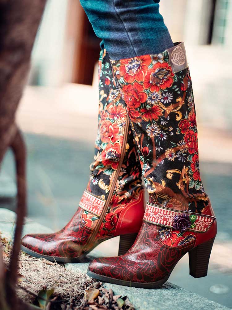 Floral cowboy-style boots with red leather toe, black floral shaft, and side zipper