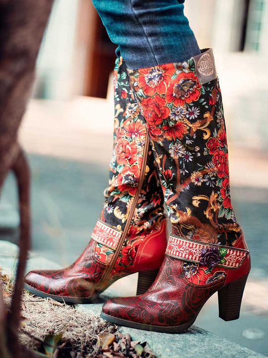 Floral cowboy-style boots with red leather toe, black floral shaft, and side zipper