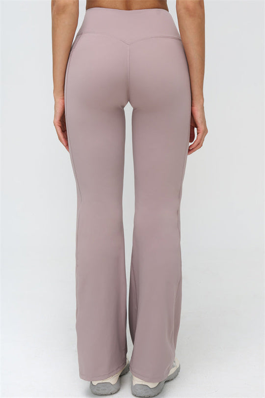 Rosa Flared Leggings mit glattem Bein und klaren Teilungsnähten am Oberschenkel