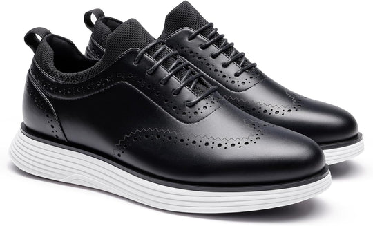 Black wingtip sneakers angled view with brogue detailing and lace-up closure