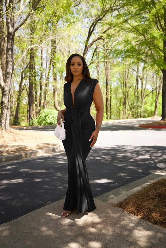 Black sleeveless deep V evening gown with draped waist and floor-length skirt