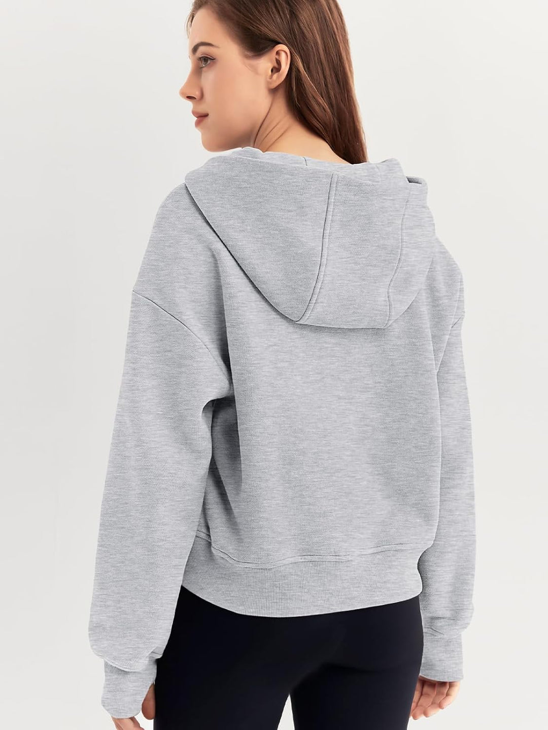 Back view of grey oversized hoodie with hood and curved hem